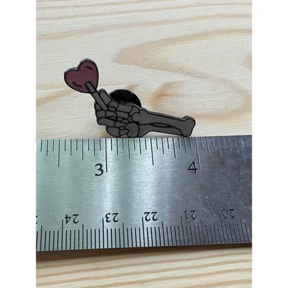 Skeleton Hand Enamel Pin Holding Heart - Picture 3 of 3